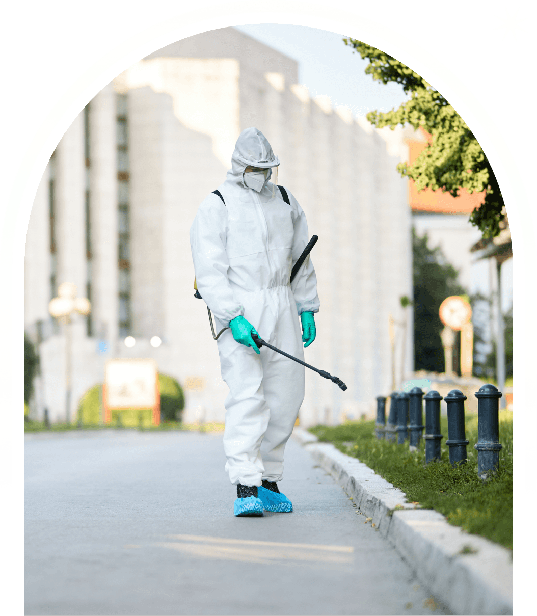 man with a safety suit exterminating pests